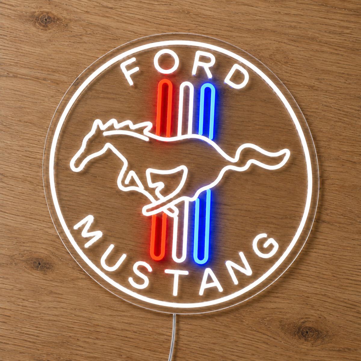 Ford Mustang Logo LED Neon Sign in red, white and blue, featuring a Ford Mustang horse logo with vertical stripes on a wooden surface.