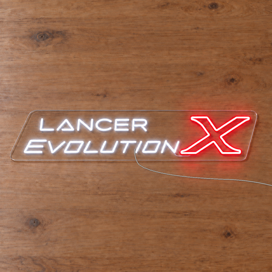 Lancer Evolution X LED Neon Sign on wooden surface with power wire connected behind neon
