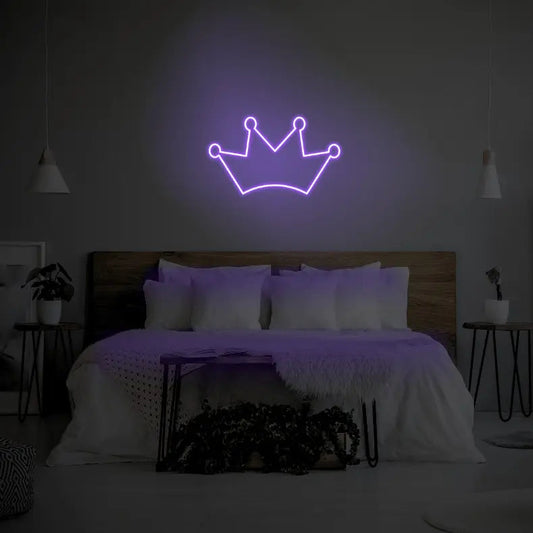 Crown LED Neon Light Sign in purple, featuring crown outline illuminated above a bed.