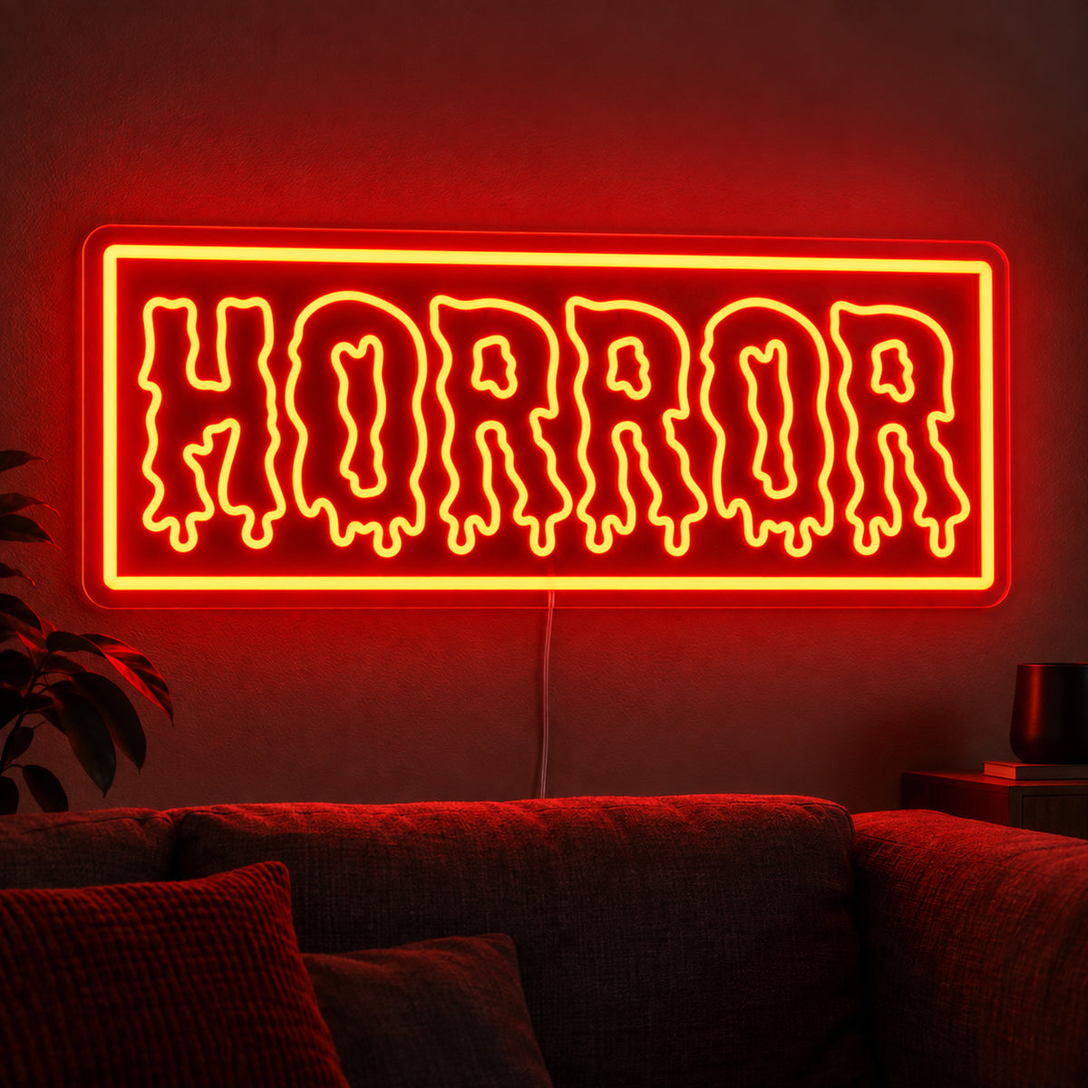 Horror Rectangle Neon Sign featuring dripping Horror lettering inside an orange rectangular border, glowing on a dark living room wall.
