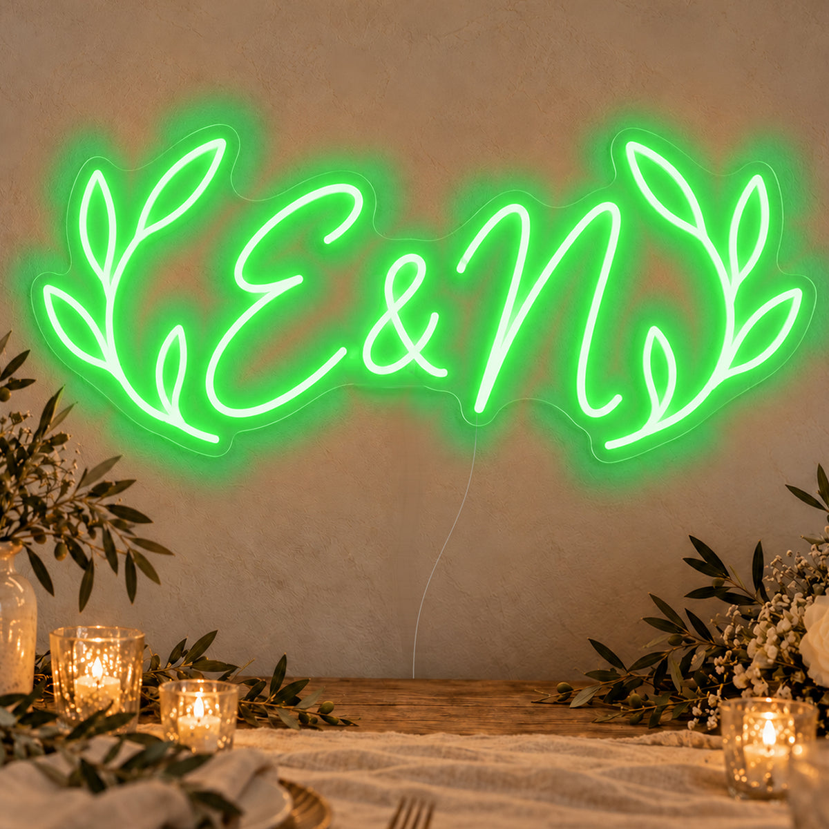 Personalised Olive Initials Neon Sign in green LED neon on clear acrylic, angled view