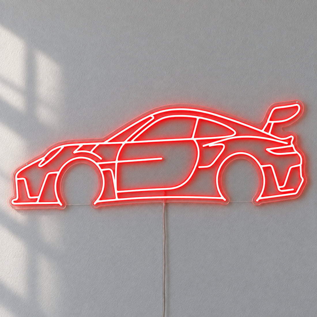 Porsche 911 LED Neon Sign in red, featuring a Porsche 911 car outline on a grey wall.