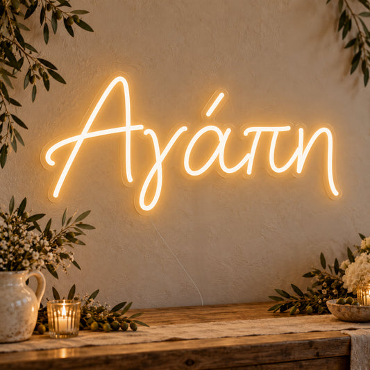 Agapi Greek Love Neon Sign on clear cut-to-shape acrylic, illuminated on a wall in a styled celebration setting