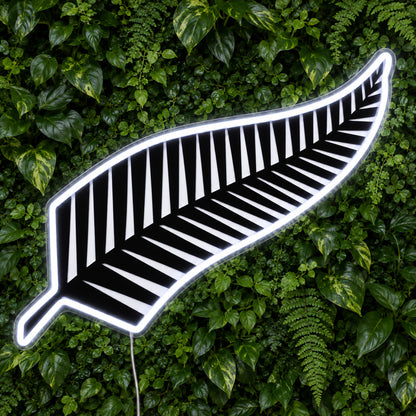 All Blacks New Zealand Rugby LED Neon Sign, featuring team logo displayed on a green foliage wall.