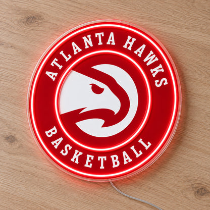 Atlanta Hawks LED Neon Sign, featuring illuminated team logo on a wooden surface.