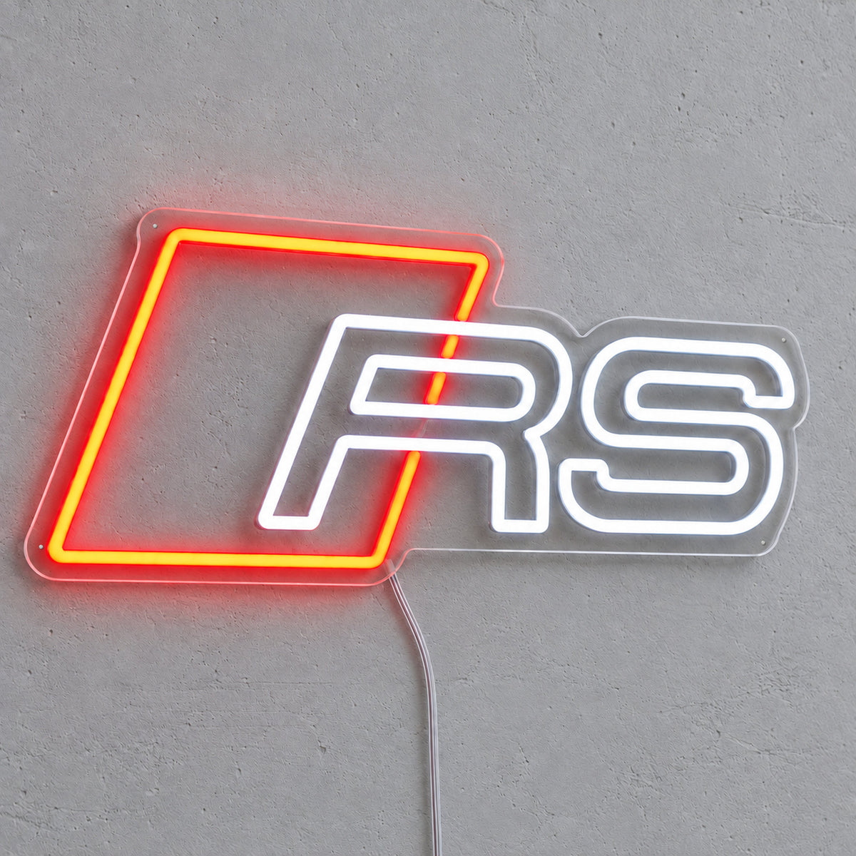 Audi RS LED Neon Sign in red and white, featuring Audi RS emblem on a grey wall.