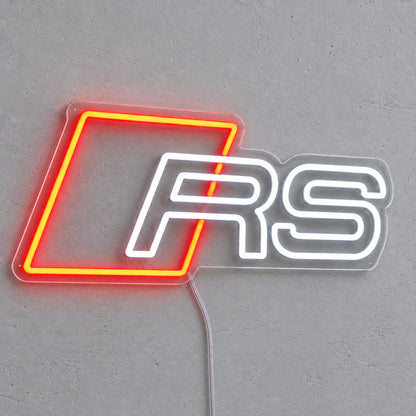Audi RS LED Neon Sign in red and white, featuring Audi RS emblem on a grey wall.