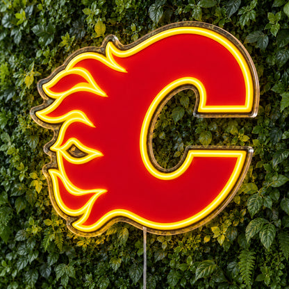 Calgary Flames LED Neon Sign, featuring team logo displayed on a green foliage wall.