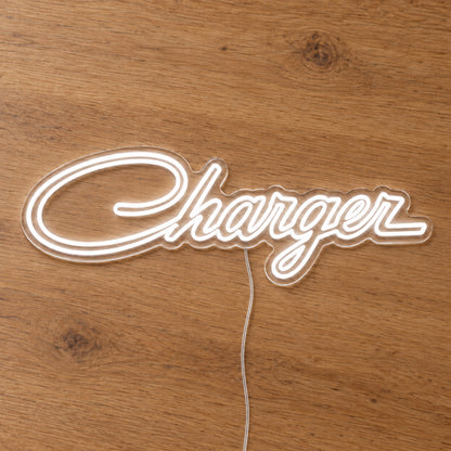 Chrysler Charger LED Neon Sign in warm white, featuring Charger script lettering on a wooden surface.