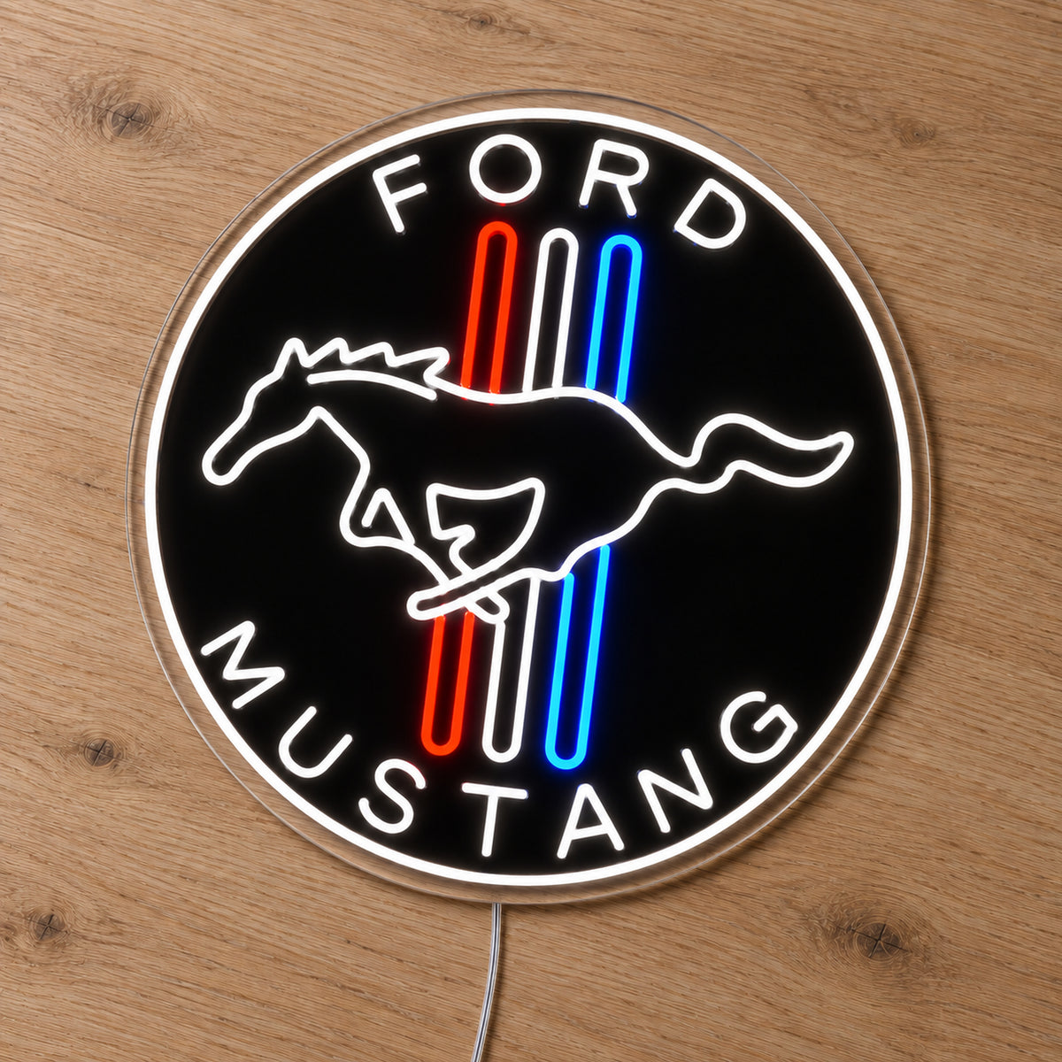 Ford Mustang Badge LED Neon Sign in red, white and blue, featuring a circular Ford Mustang horse badge on a wooden surface.