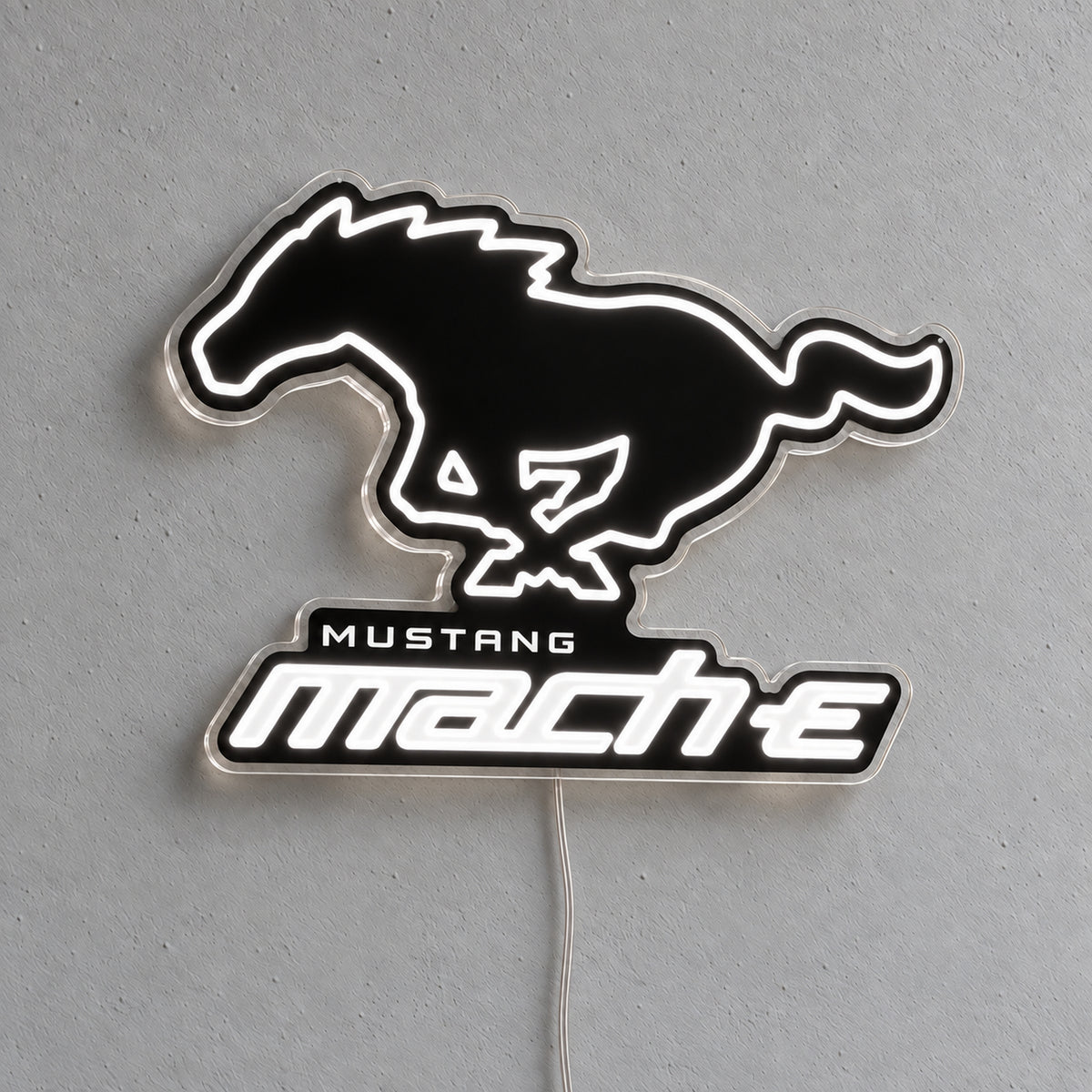 Ford Mustang Mach-E LED Neon Sign in white, featuring a Mustang horse and Mach-E lettering on a grey wall.