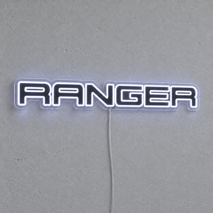Ford Ranger LED Neon Sign in white, featuring Ranger lettering on a grey wall.