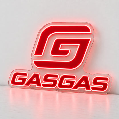 GasGas Logo LED Neon Sign, featuring illuminated GasGas emblem and lettering standing on a light reflective surface.