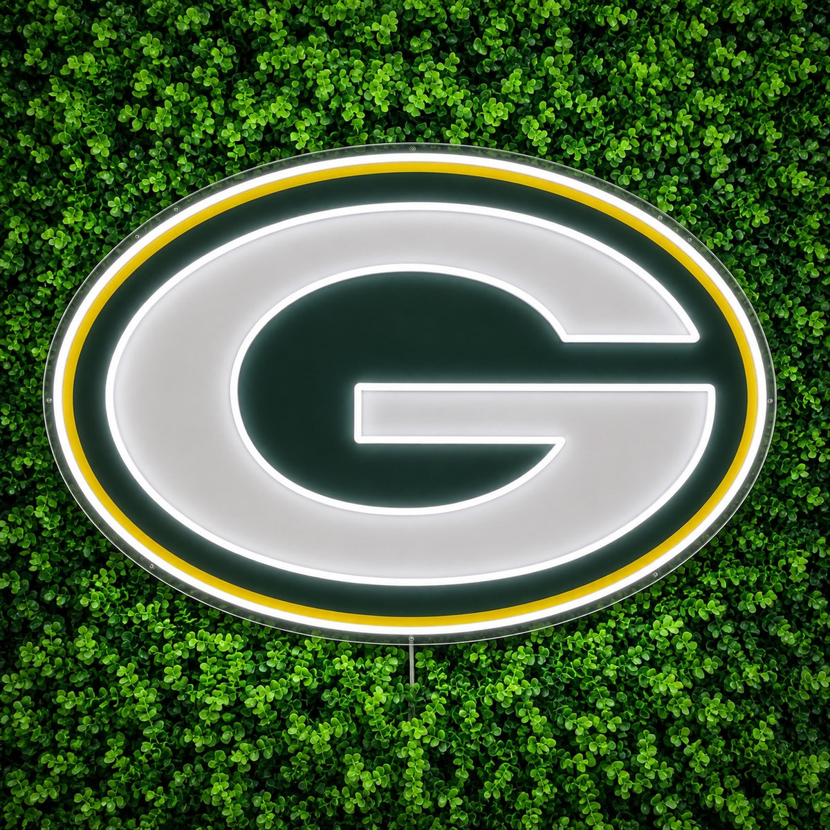 Green Bay Packers LED Neon Sign, featuring illuminated team logo on a green foliage wall.