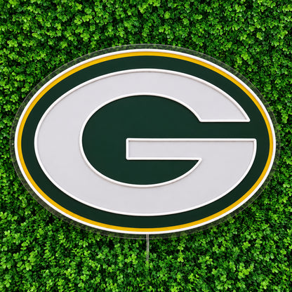 Green Bay Packers LED Neon Sign, featuring illuminated team logo on a green foliage wall.