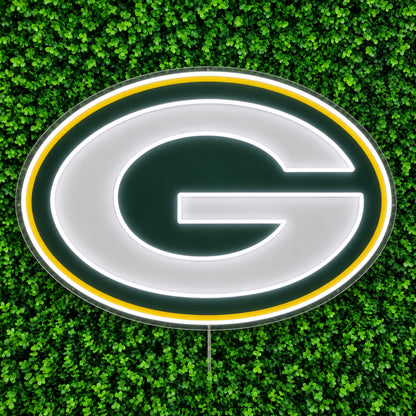 Green Bay Packers LED Neon Sign, featuring illuminated team logo on a green foliage wall.