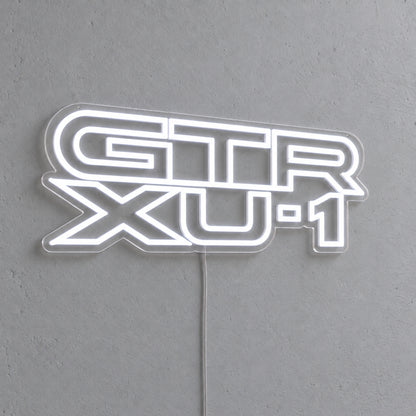Holden Torana GTR-XU1 LED Neon Sign in white, featuring stacked GTR XU-1 lettering on a grey wall.