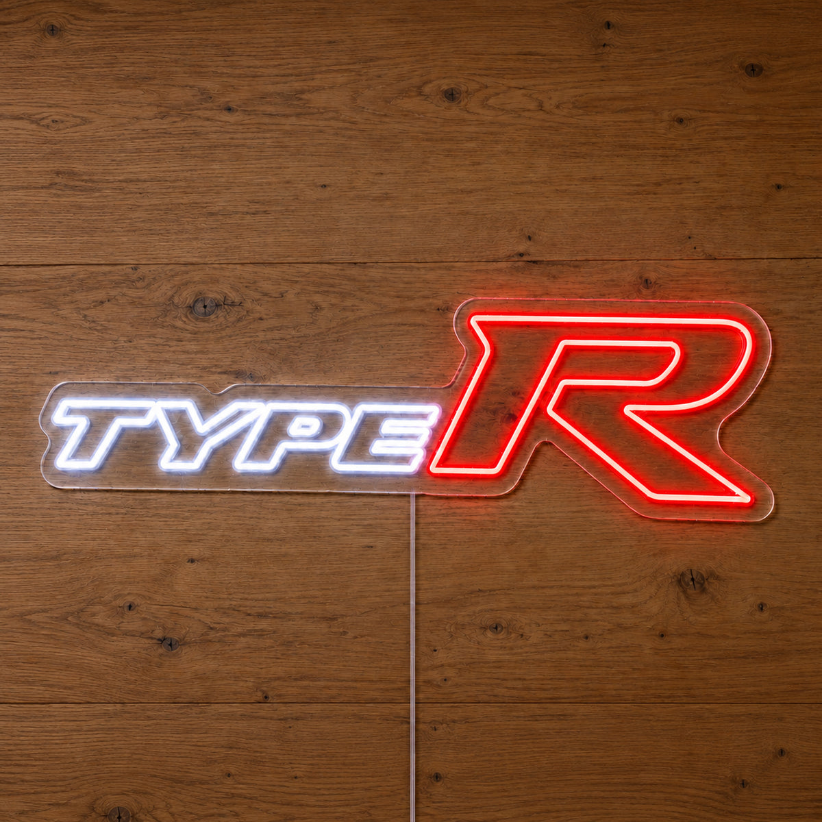 Honda Type-R LED Neon Sign in white and red, featuring Honda Type-R lettering on a wooden surface.