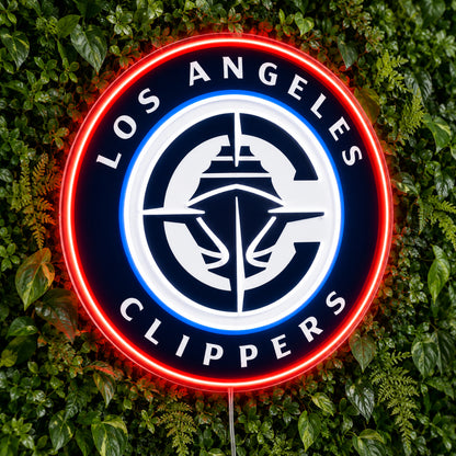 LA Clippers LED Neon Sign, featuring illuminated team logo on a green foliage wall.