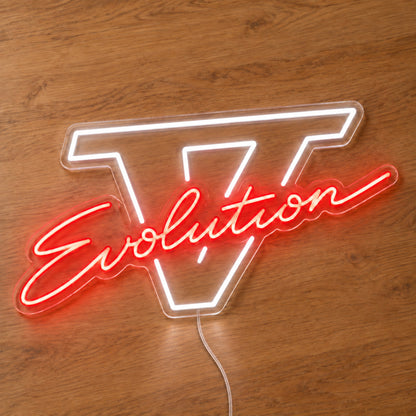 Lancer Evolution V LED Neon Sign in red and white, featuring Evolution script over a Roman numeral V on a wooden surface.