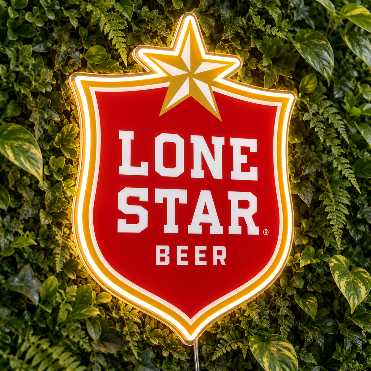 Lone Star Beer LED Neon Sign, featuring beer-brand logo displayed on a green foliage wall.