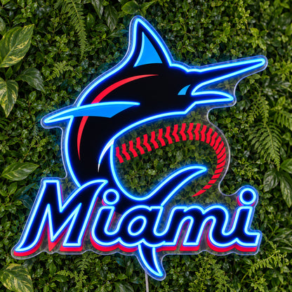 Miami Marlins LED Neon Sign, featuring team logo displayed on a green foliage wall.