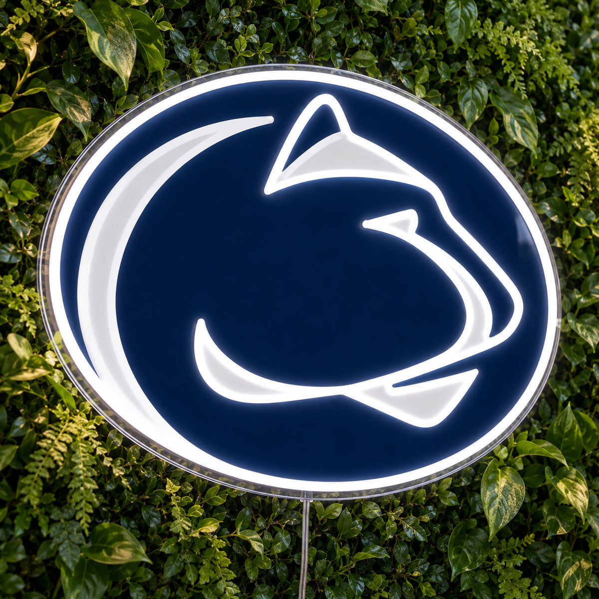 Penn State Nittany Lions LED Neon Sign, featuring team logo displayed on a green foliage wall.