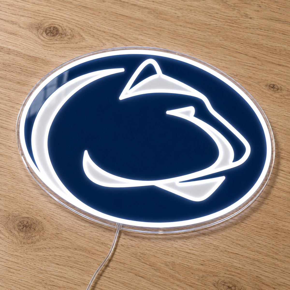 Penn State Nittany Lions LED Neon Sign, featuring team logo displayed on a wooden surface.