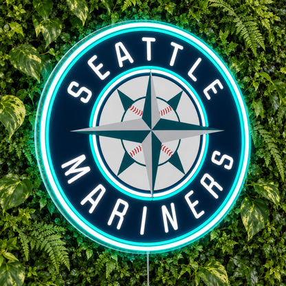 Seattle Mariners LED Neon Sign, featuring illuminated team logo on a green foliage wall.