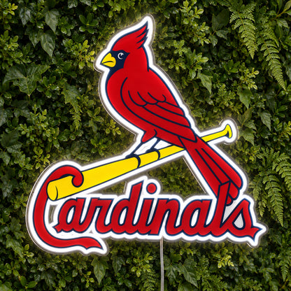 St. Louis Cardinals LED Neon Sign, featuring team logo displayed on a green foliage wall.