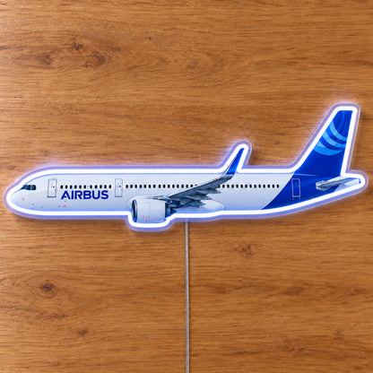 Airbus A321neo Neon Sign with printed aircraft details and an illuminated LED outline on clear acrylic, shown on a wooden surface