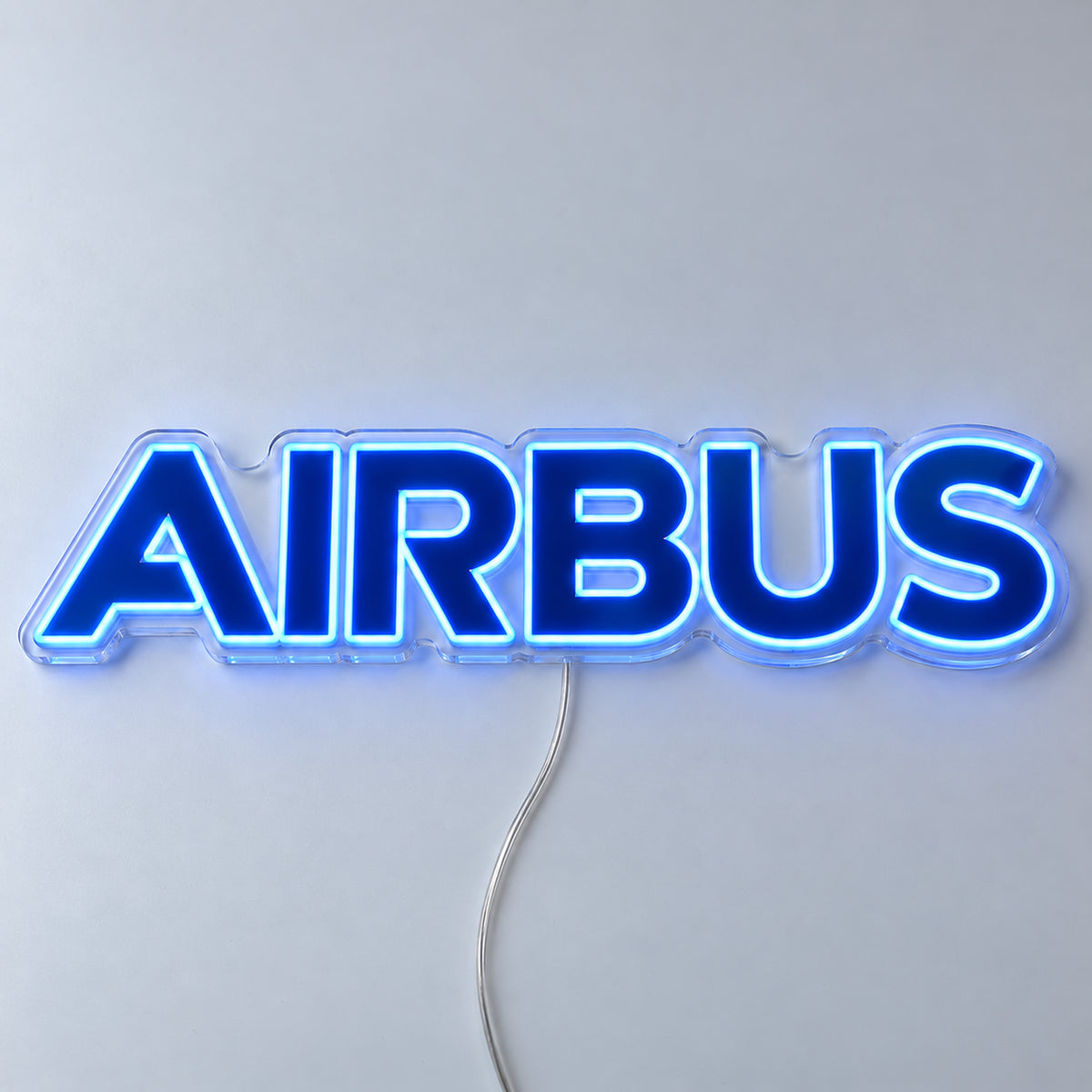 Airbus Logo Neon Sign with blue LED lettering on clear acrylic, shown from the front on a white surface