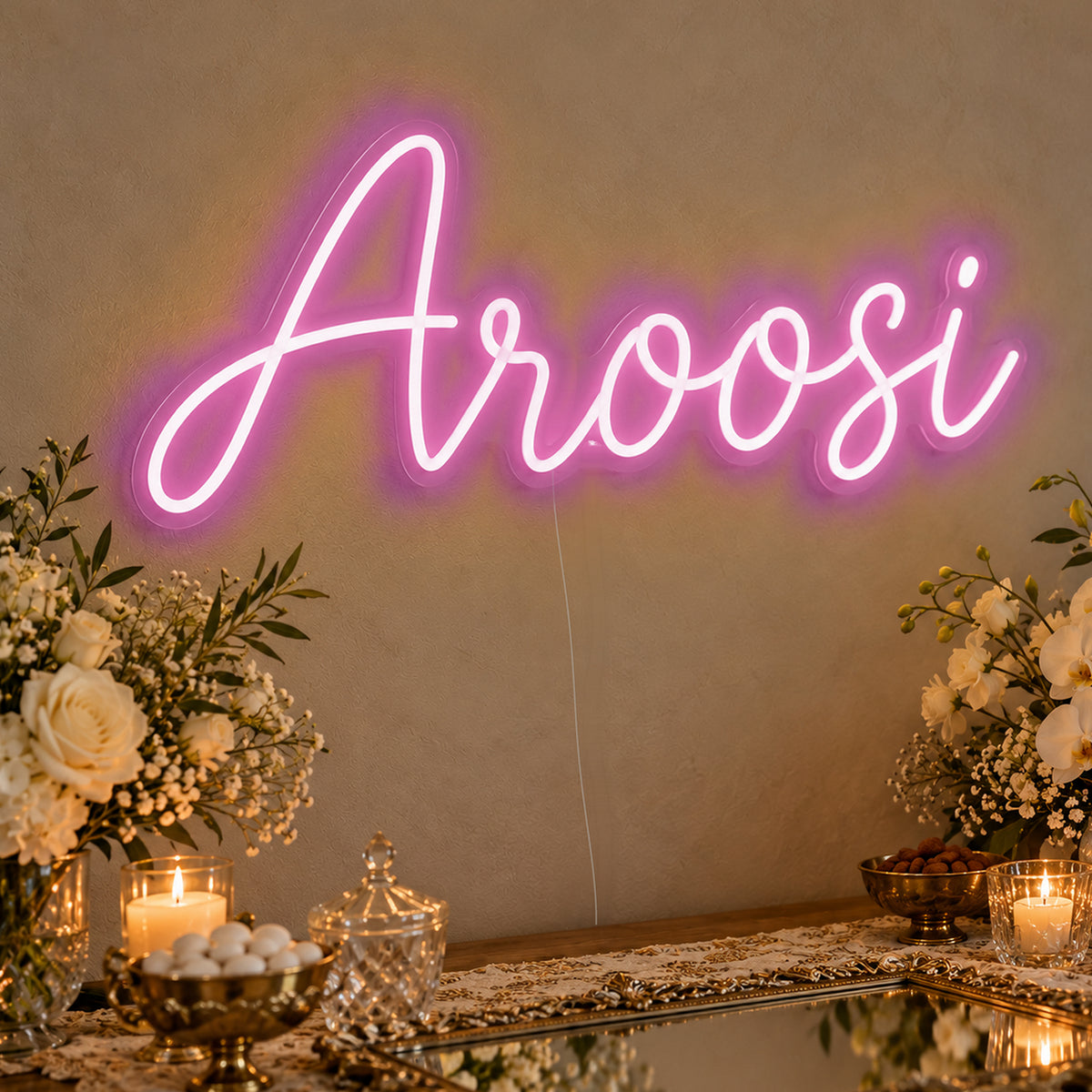 Aroosi Neon Sign in pink LED neon on clear acrylic, angled view
