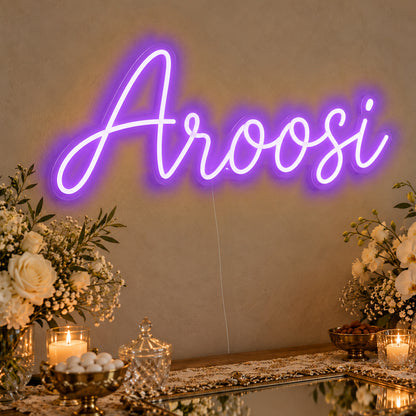 Aroosi Neon Sign in purple LED neon on clear acrylic, angled view