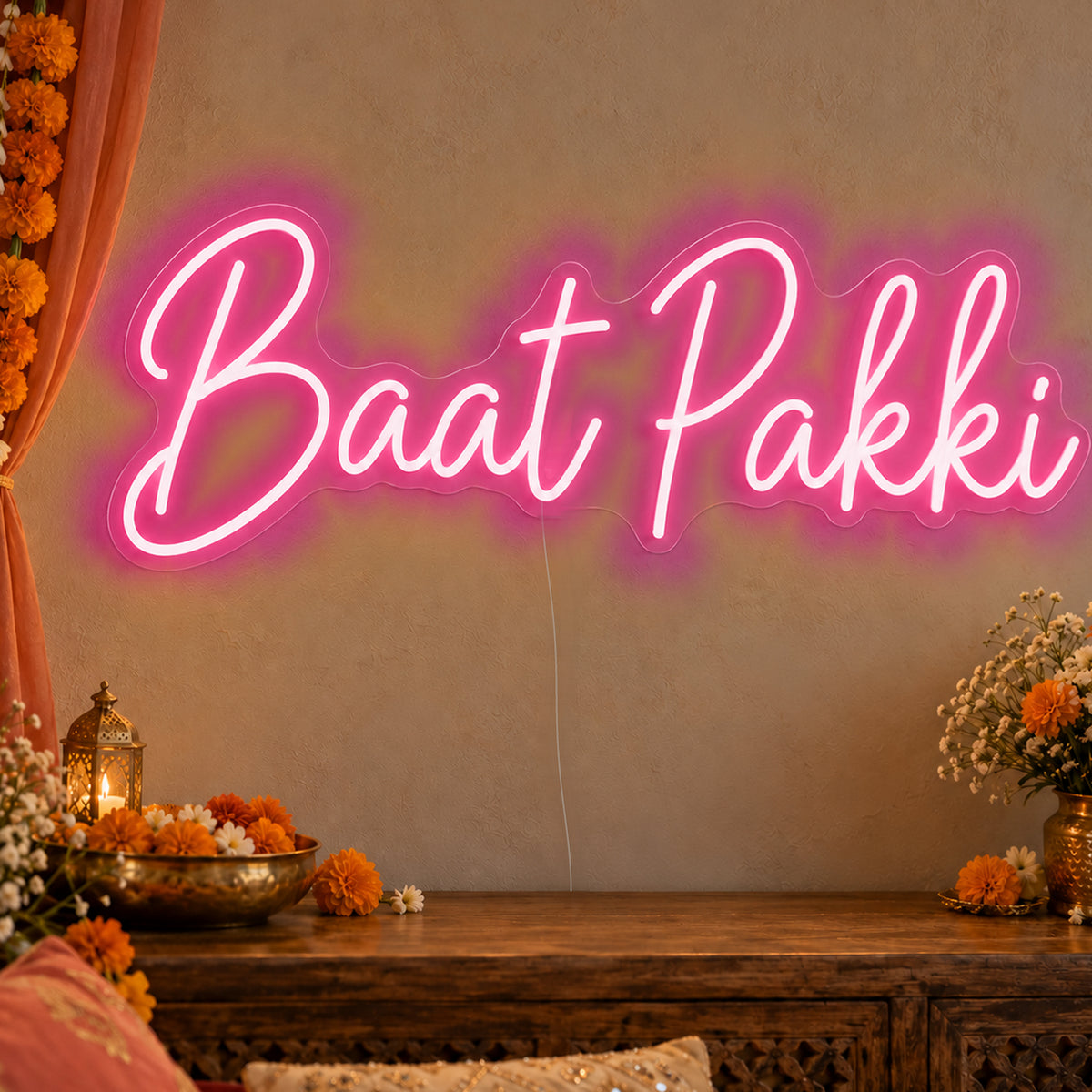Baat Pakki Neon Sign in rose red LED neon on clear acrylic, angled view