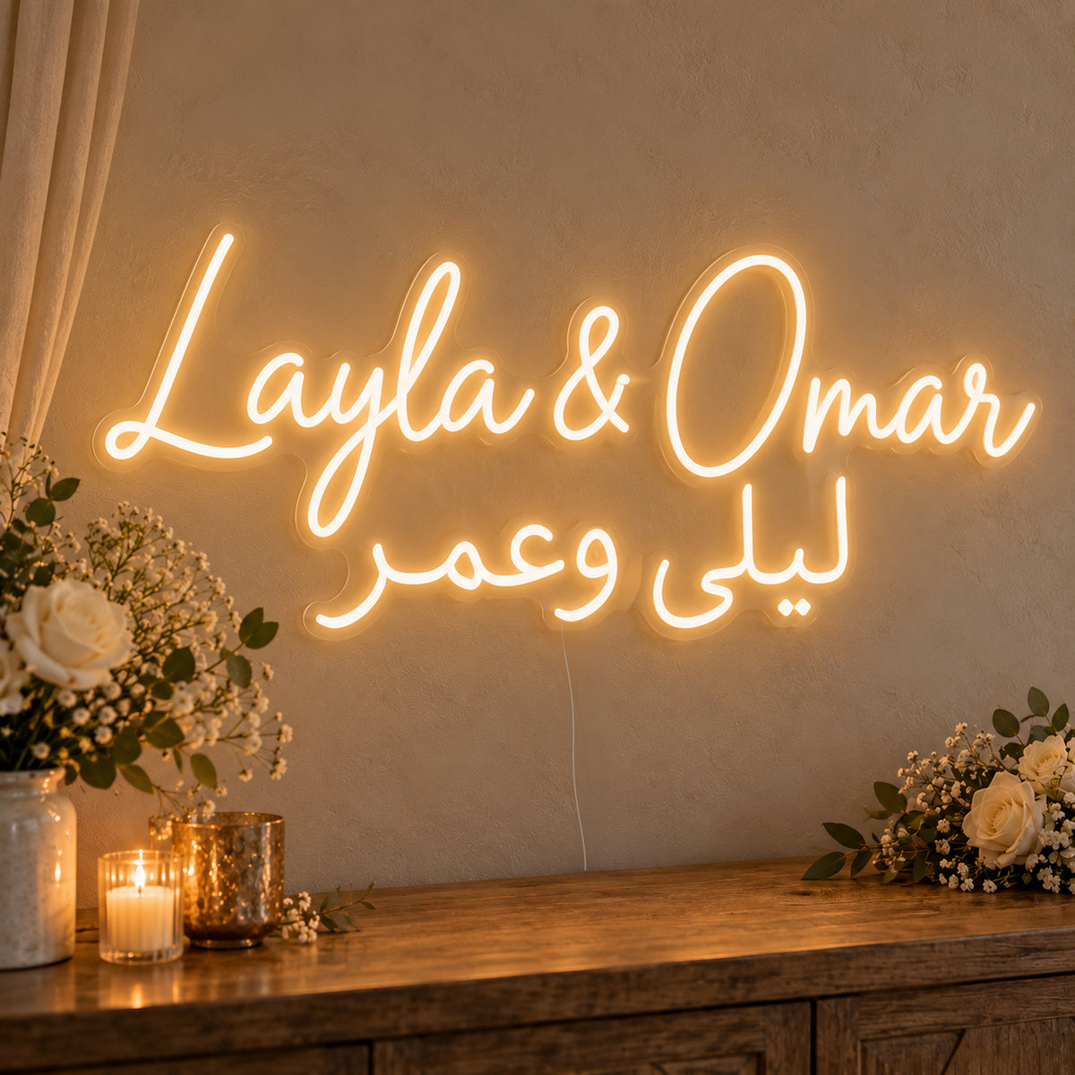 Personalised Bilingual Arabic English Names Neon Sign on clear cut-to-shape acrylic in an illuminated wall display; example personalisation shown.