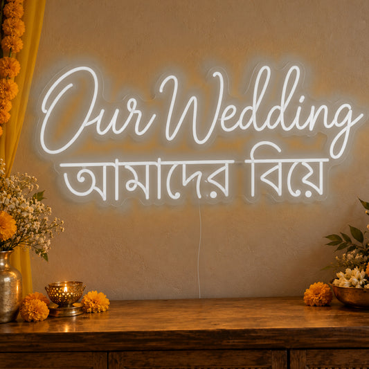 Our Wedding English & Bengali Neon Sign in white LED neon on clear acrylic, angled view