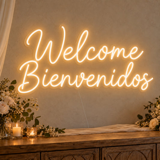 Welcome English & Spanish Neon Sign on clear cut-to-shape acrylic, illuminated on a wall in a styled celebration setting
