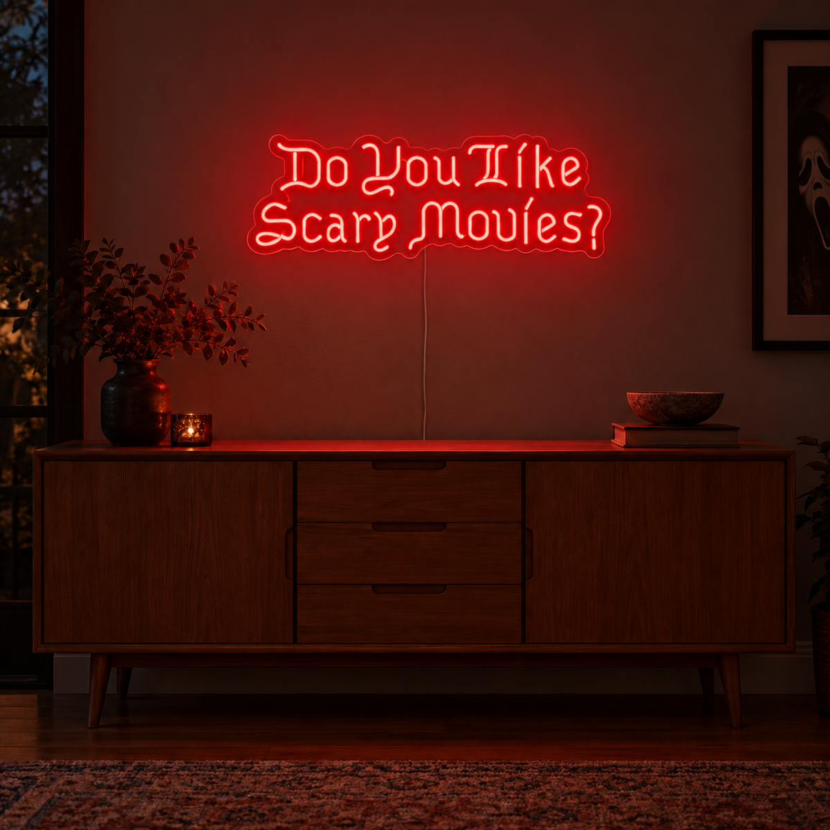 Do You Like Scary Movies Neon Sign featuring the question Do You Like Scary Movies in decorative red lettering, displayed on a dark wall above a wooden sideboard.
