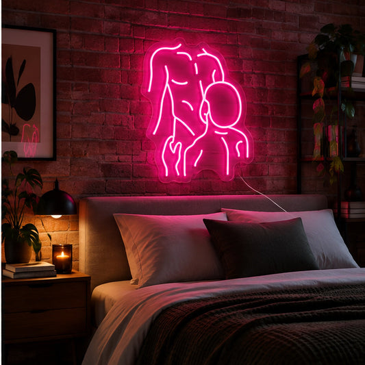Gay Pride Two Men Neon Sign glowing pink above a bed in a modern apartment