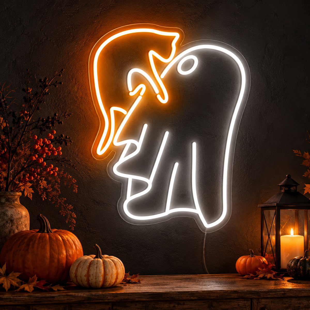 Ghost with Witch Hat Neon Sign featuring a white ghost wearing a floppy orange witch hat, glowing on a dark wall in a Halloween room display.