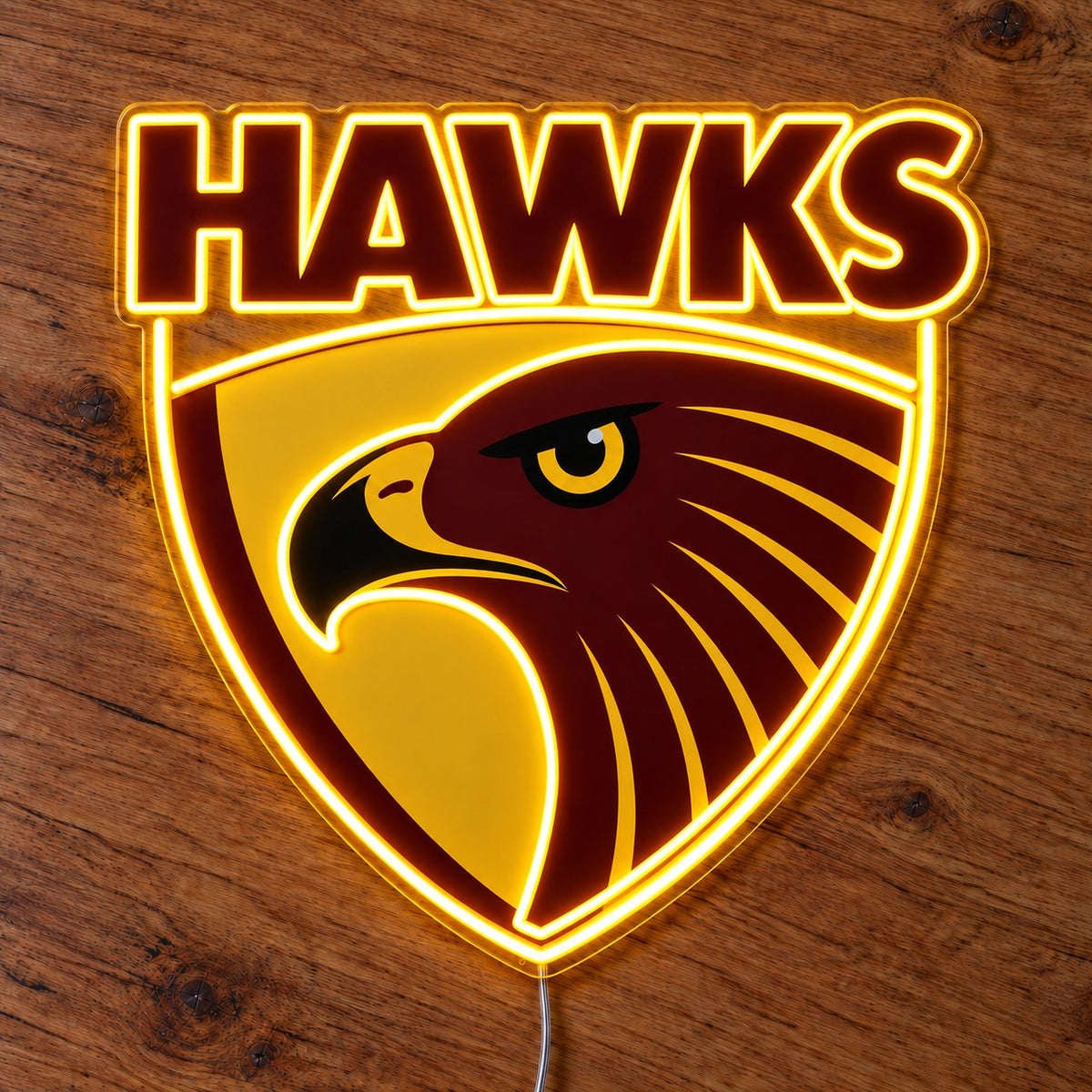 Hawthorn Hawks LED Neon Sign, featuring illuminated team logo on a wooden surface.
