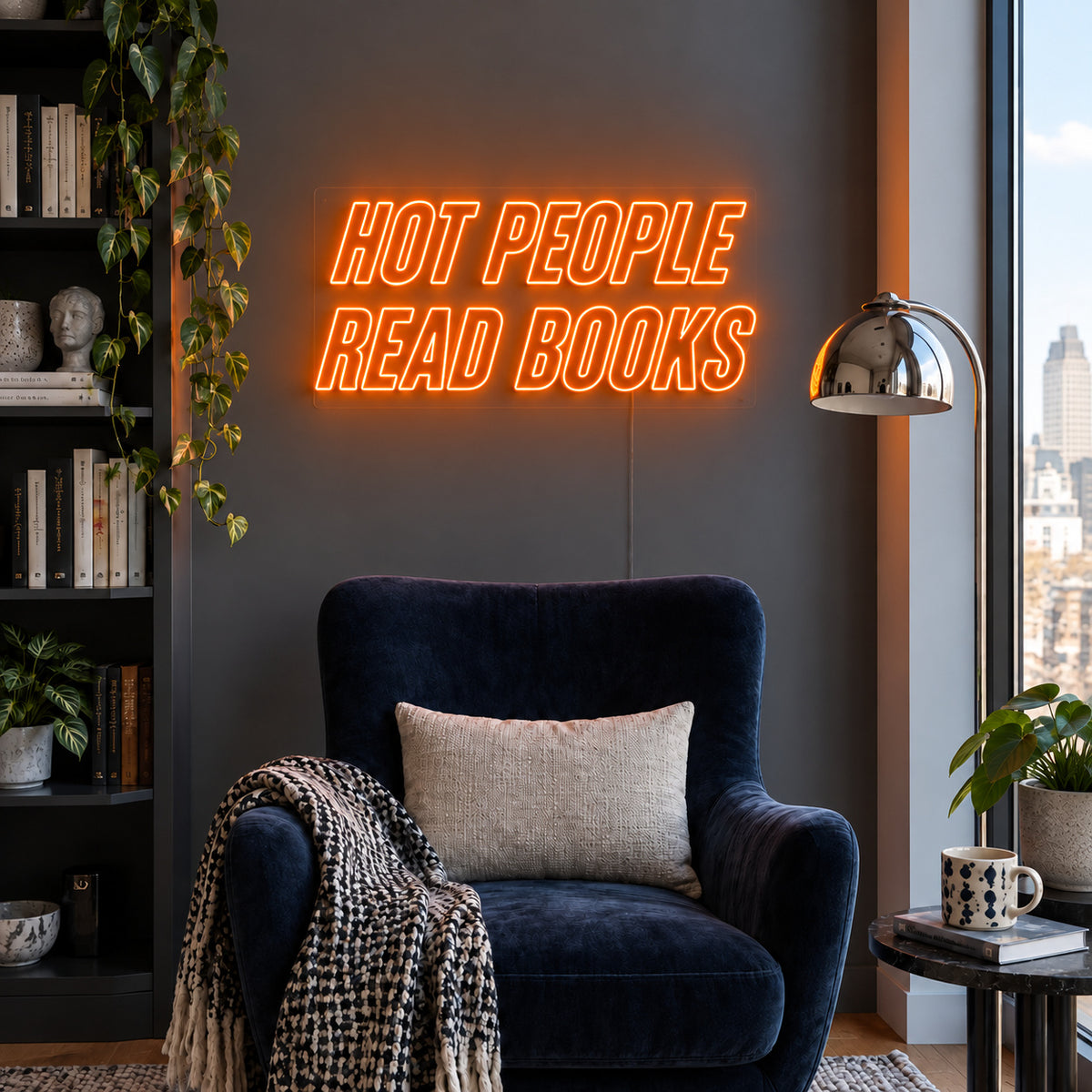 Orange version of the Hot People Read Books Neon Sign, shown above a blue reading chair.