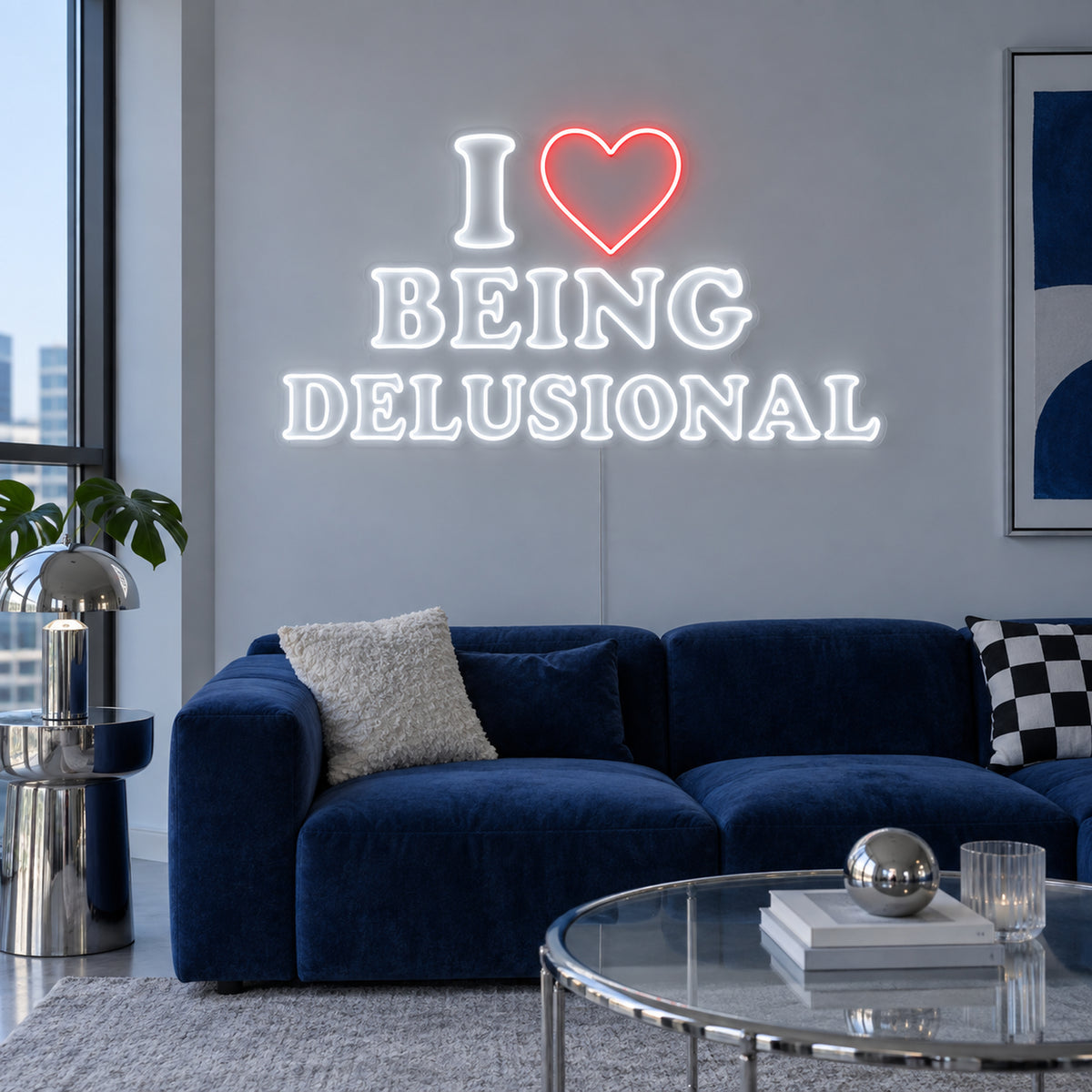 I Love Being Delusional Neon Sign with white outlined lettering and a red heart in a stacked layout on transparent acrylic, displayed on a living room wall