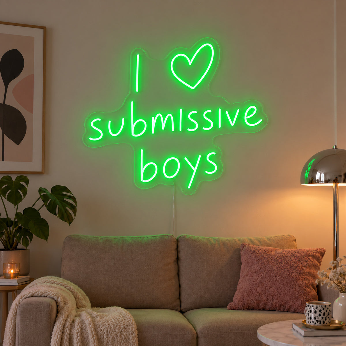 I Love Submissive Boys Neon Sign with green lighting, displayed above a neutral sofa.