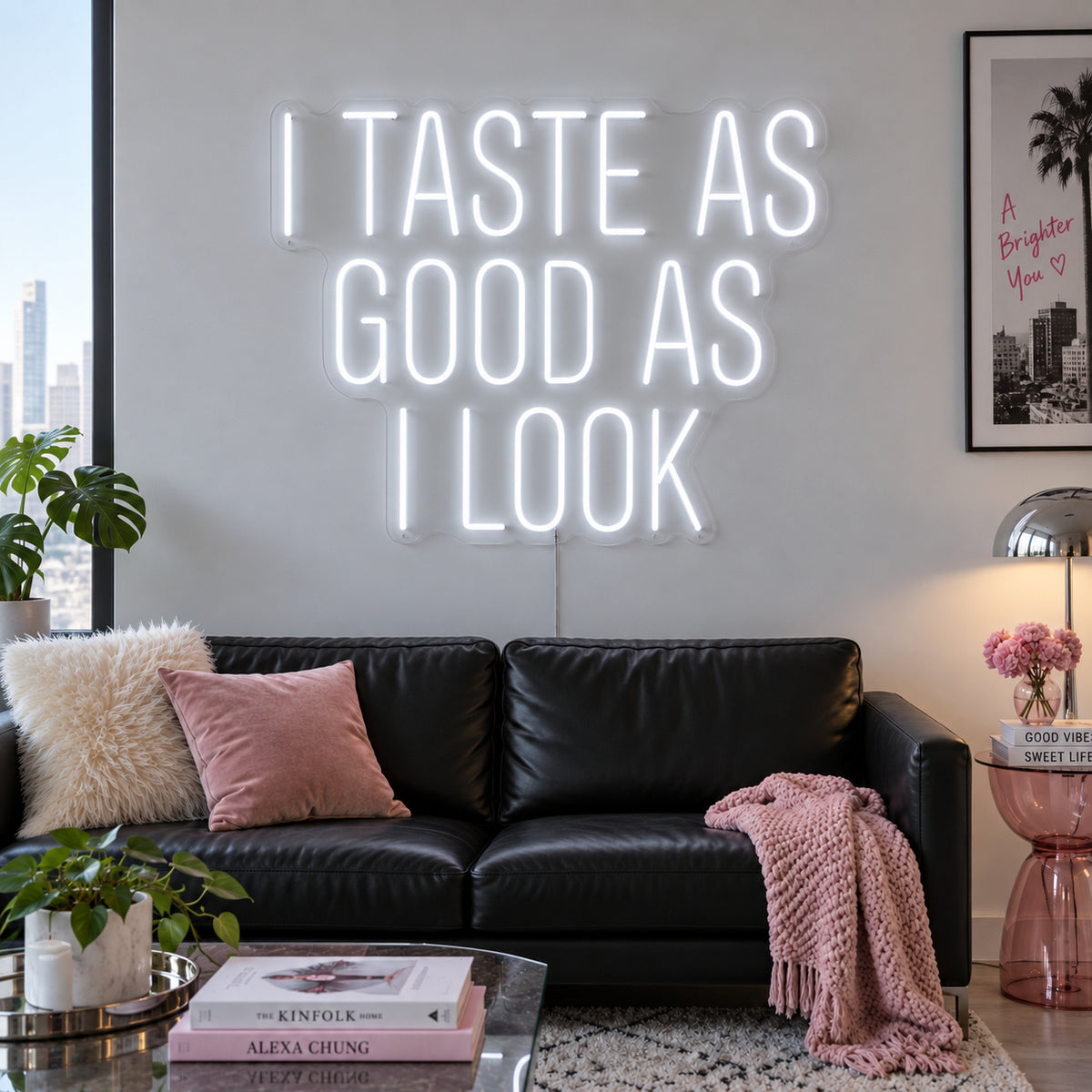 I Taste As Good As I Look Neon Sign, RGB colour-changing option shown in white above a black sofa.