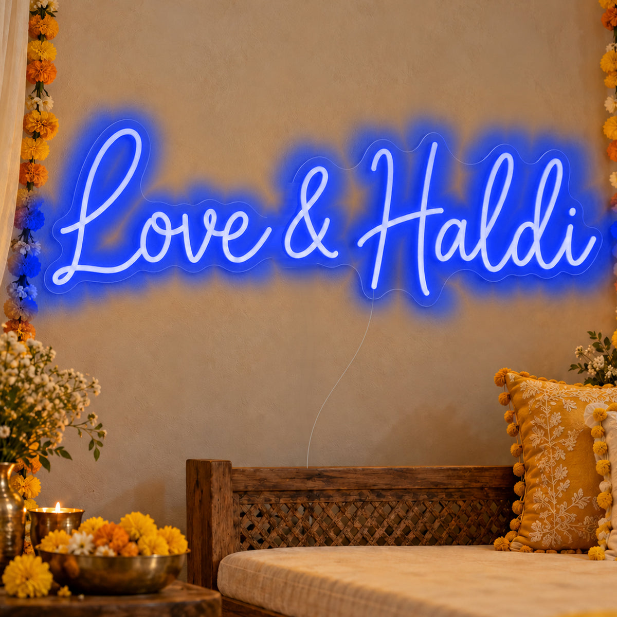 Love Haldi Neon Sign in blue LED neon on clear acrylic, angled view
