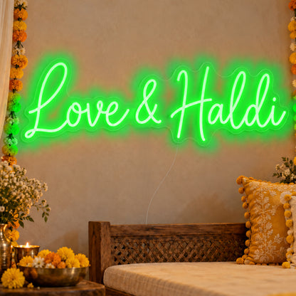 Love Haldi Neon Sign in green LED neon on clear acrylic, angled view