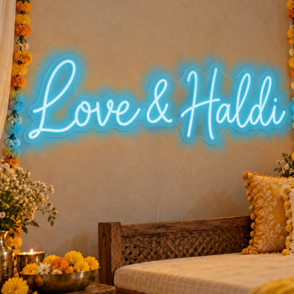 Love Haldi Neon Sign in ice blue LED neon on clear acrylic, angled view