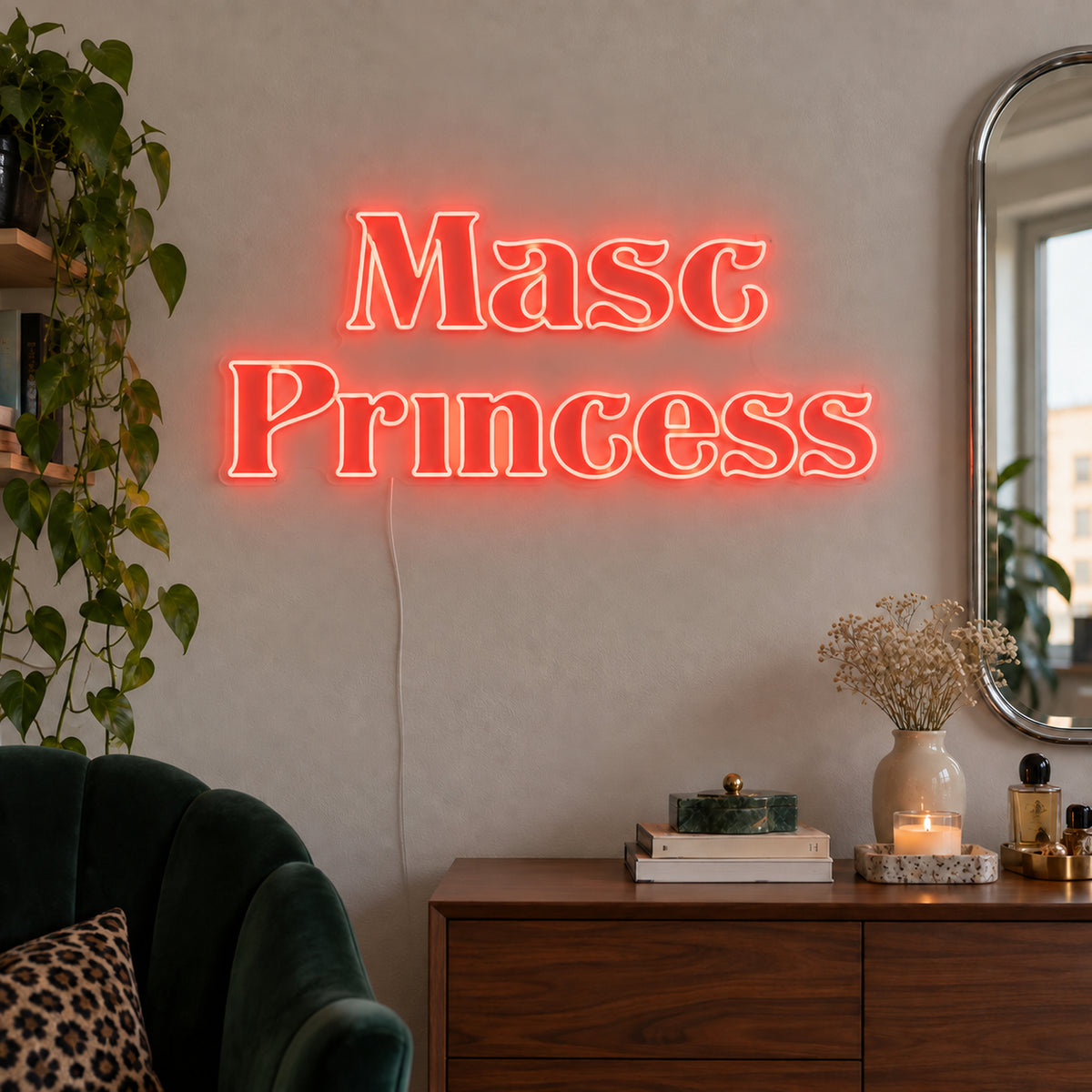 Masc Princess Neon Sign in red above a wooden sideboard beside a green chair.
